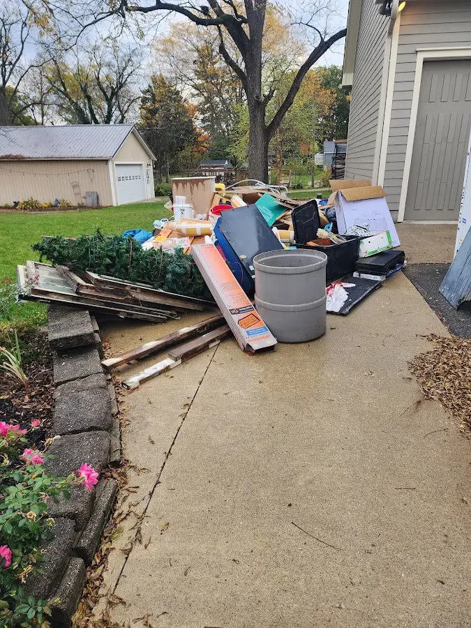 Dumpster being loaded with debris for Roofing Dumpster Rental in West View